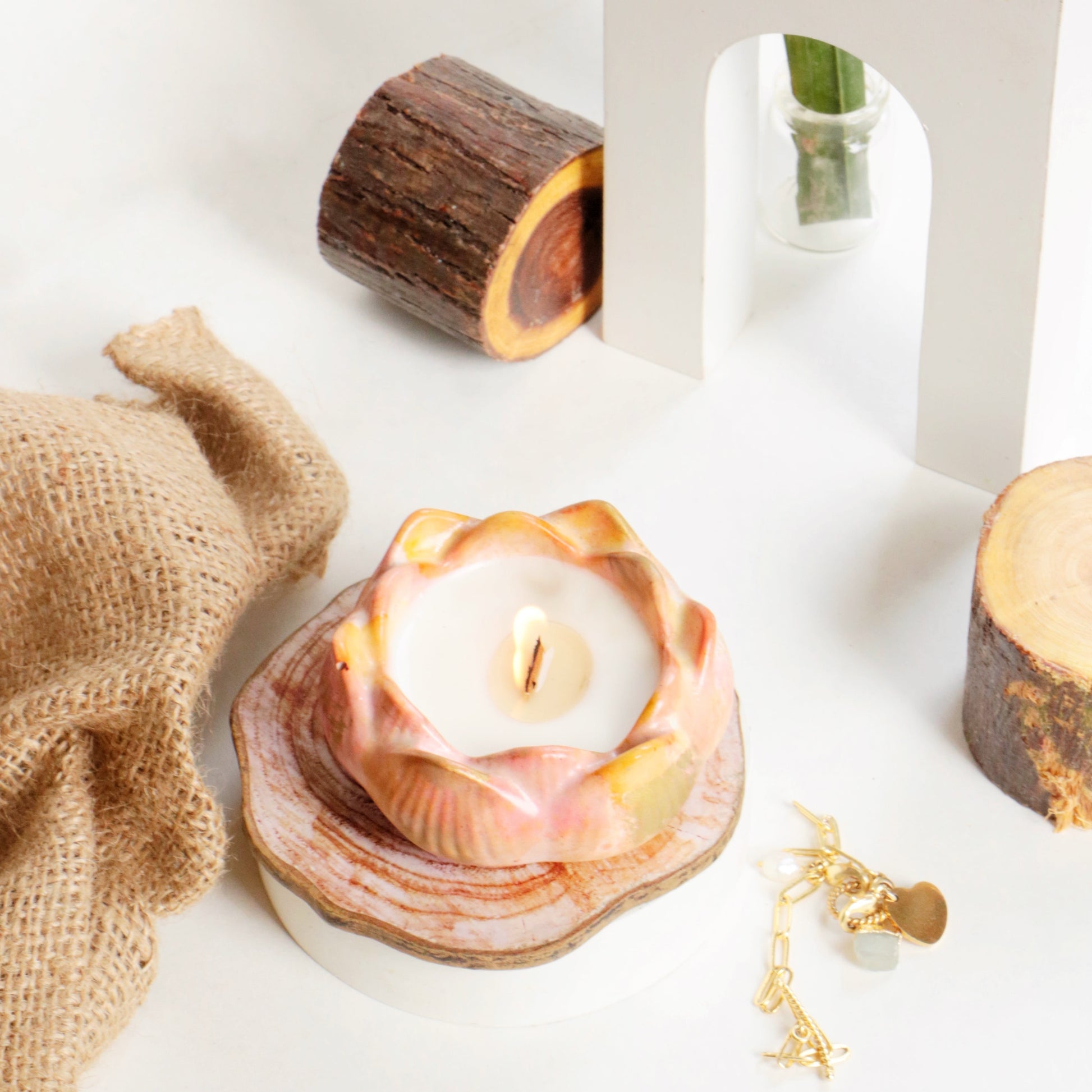 Aromatic candle burning on a table, creating a relaxing atmosphere