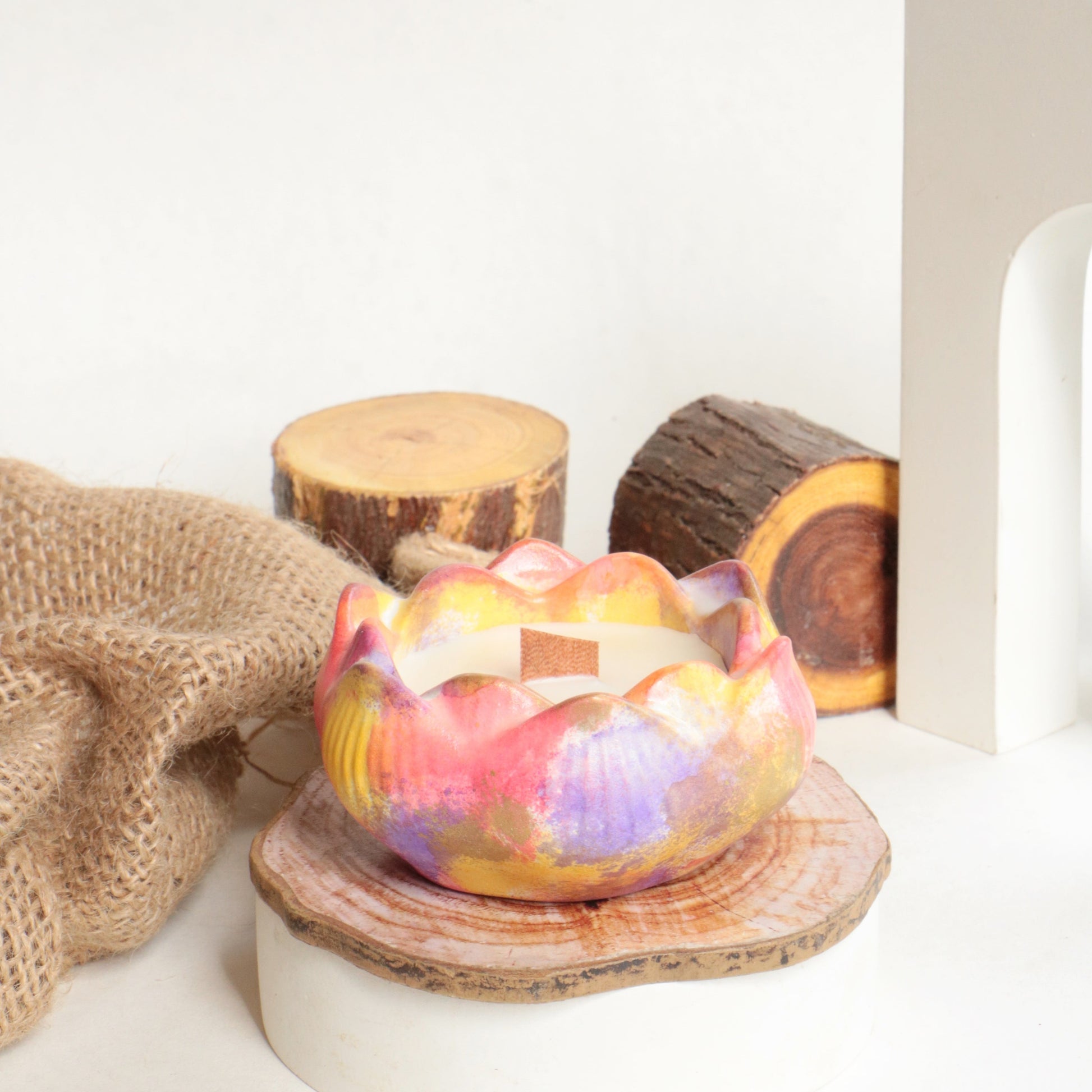 Colorful layered candle creating a captivating display and a delightful scent.