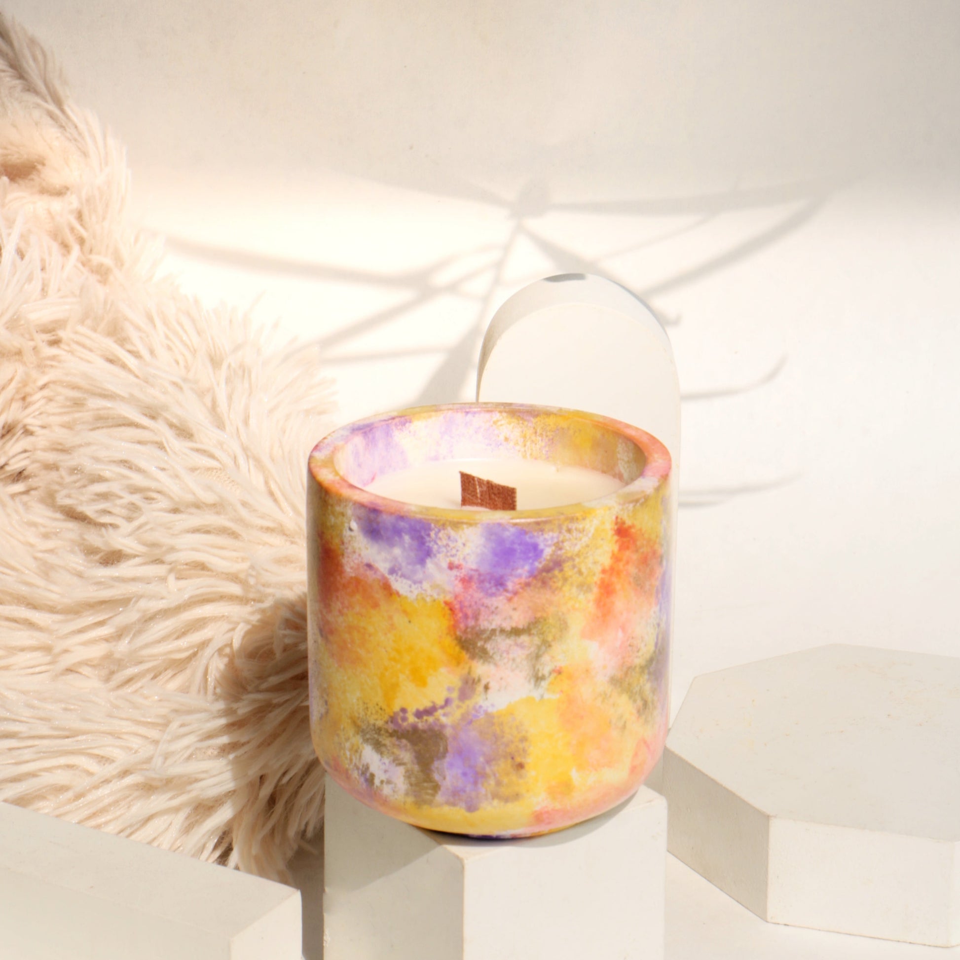 Lavender candle promoting relaxation and calmness.
